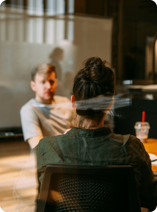 male and female in conference room male and female in conference room